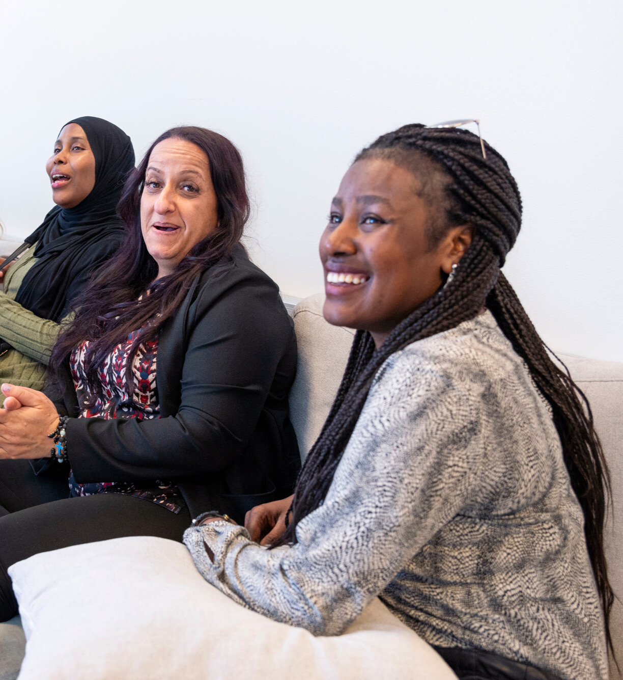 Finnish language students sit on the couch